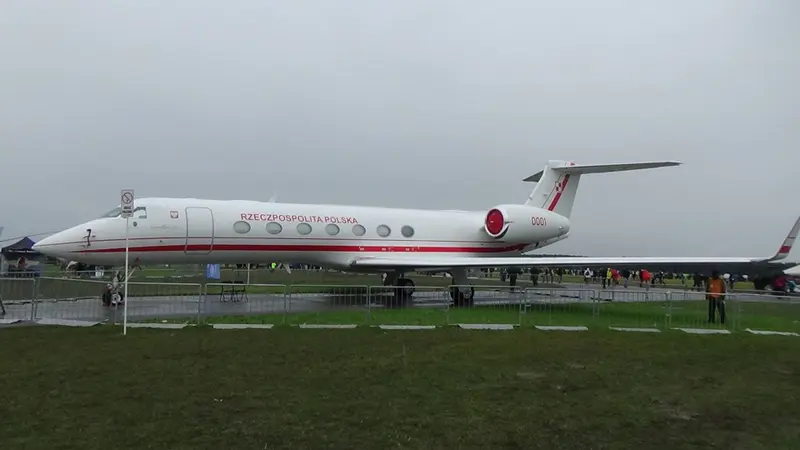 Gulfstream G550 — Ultra-long-range jet exterior A sleek white Gulfstream G550 ultra-long-range private jet is parked on an airfield, showcasing its exterior side profile.