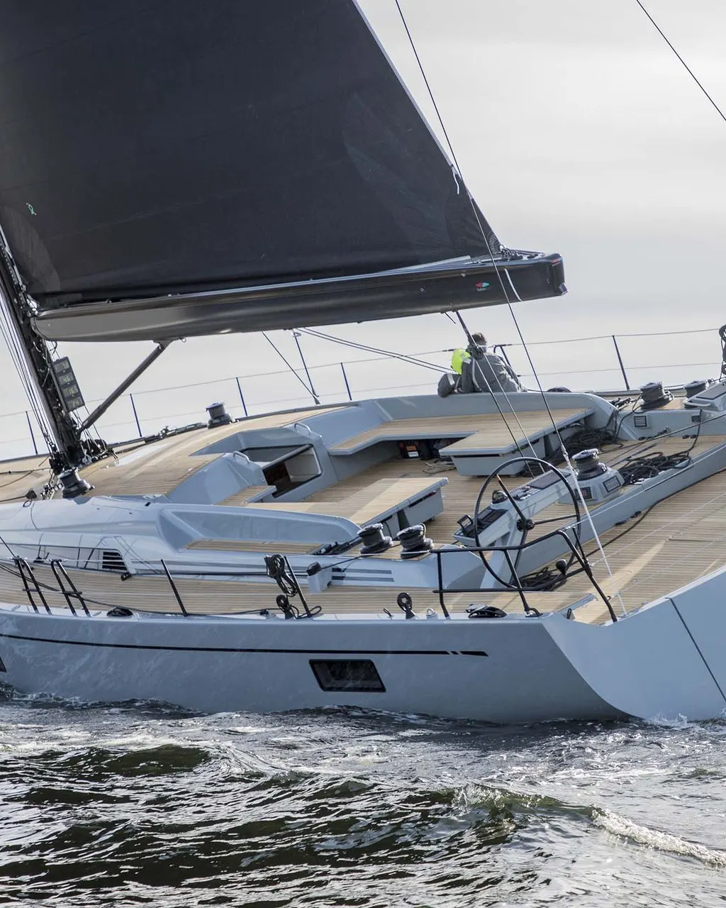 Swan 78 — Sailing Bow Action Barcelona The Nautor Swan 78 sailing yacht heeling under full sail, bow action shot, available for charter from Barcelona.